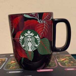 Starbucks Black Mug with Red and Green Poinsettia Design